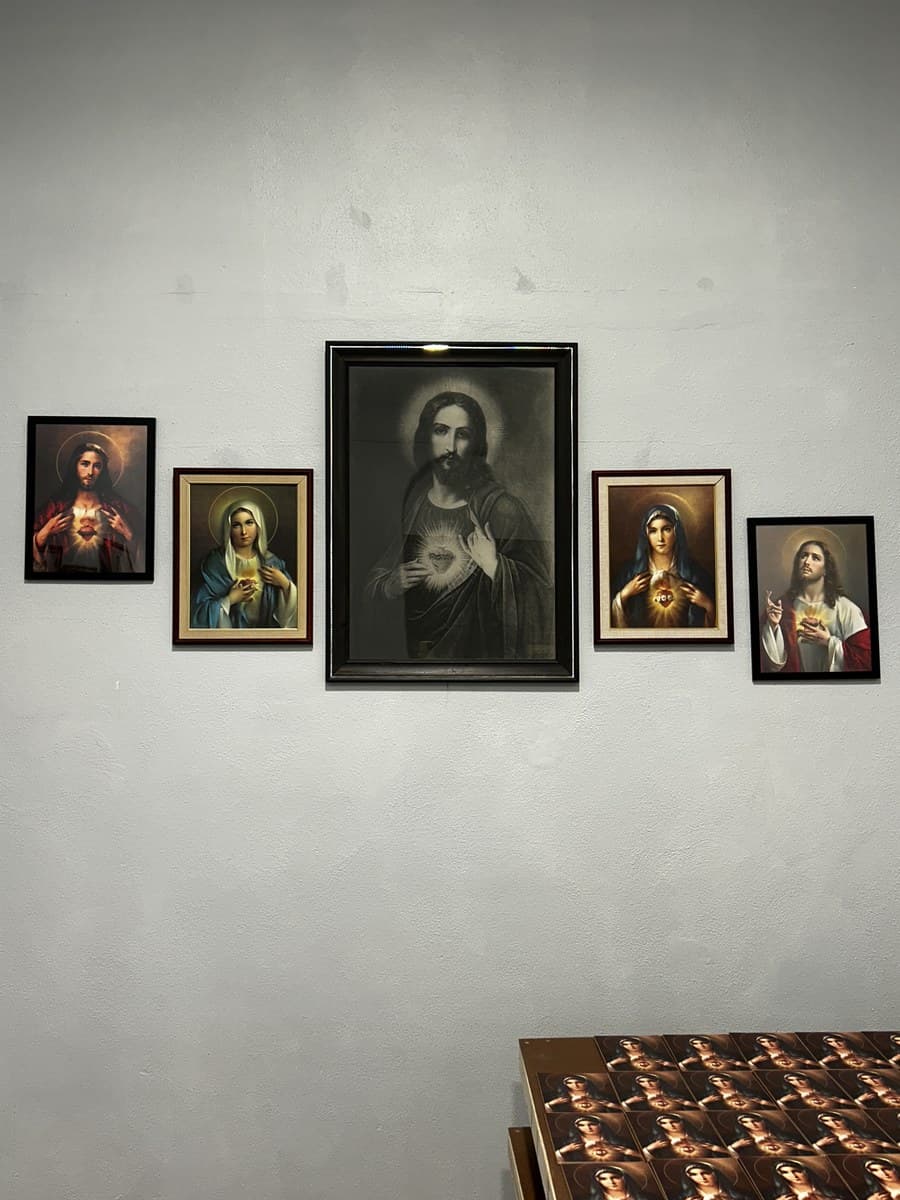 Wall display of Sacred Heart and Immaculate Heart framed images at our Cincinnati center