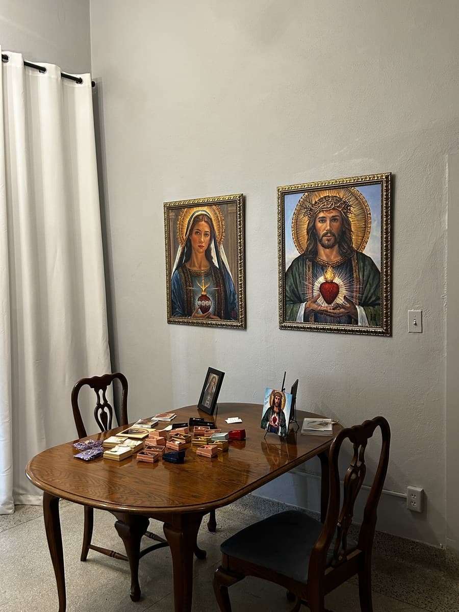 Our ministry space showing sacred art prints and products available for families