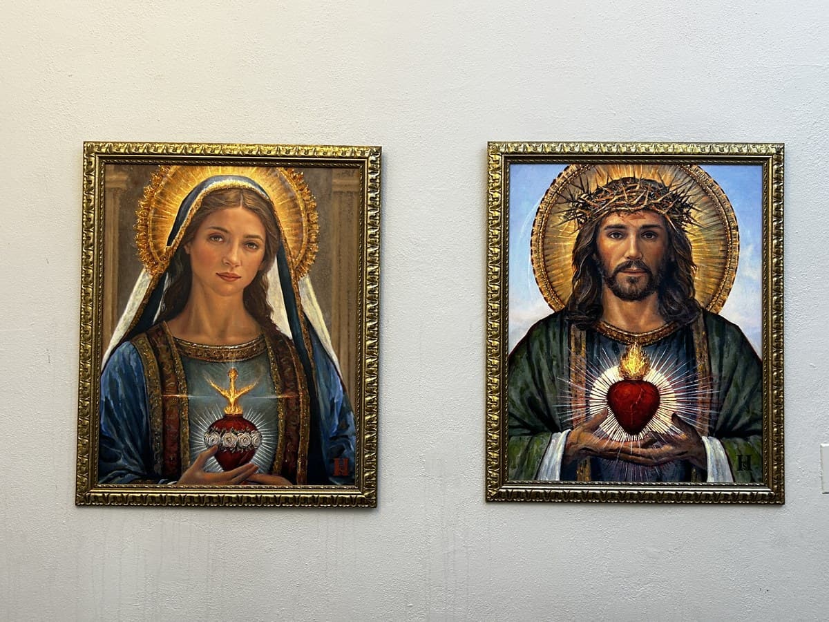 Beautiful framed Sacred Heart of Jesus and Immaculate Heart of Mary paintings at our ministry